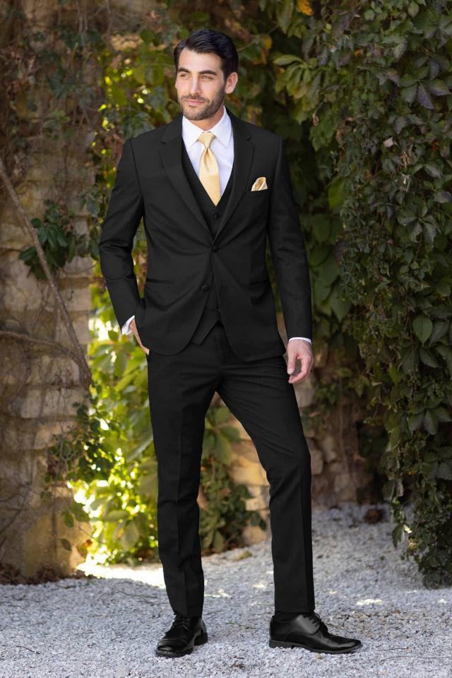 man wearing Michael Kors Force Black Performance Stretch Tuxedo and yellow tie